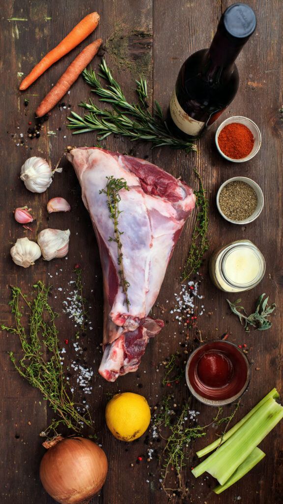 A single, clean graphic with a 2x2 grid of four numbered, high-quality photographic steps on a white background. Each image should be a clear, close-up action shot:Step 1 (Herb Rub): A close-up of hands massaging the garlic and herb paste all over the surface of the raw lamb shoulder.Step 2 (Searing): The lamb shoulder sizzling, fat-side down, in a hot Dutch oven, forming a deep brown crust.Step 3 (Braising): The seared lamb nestled on a bed of vegetables in the Dutch oven, with liquid added, ready to go into the oven with the lid on.Step 4 (Shredding): Two forks pulling apart a large piece of the cooked lamb shoulder, showing it effortlessly separating into tender shreds.